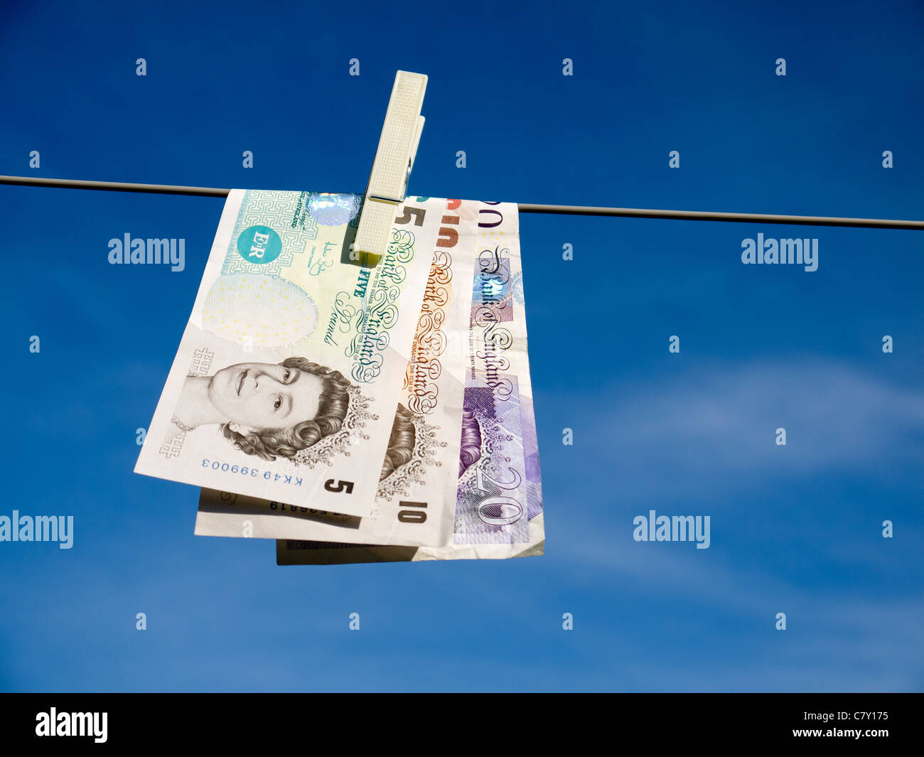 Concept representing money laundering £20 £10 and £5 pegged on a washing line Stock Photo