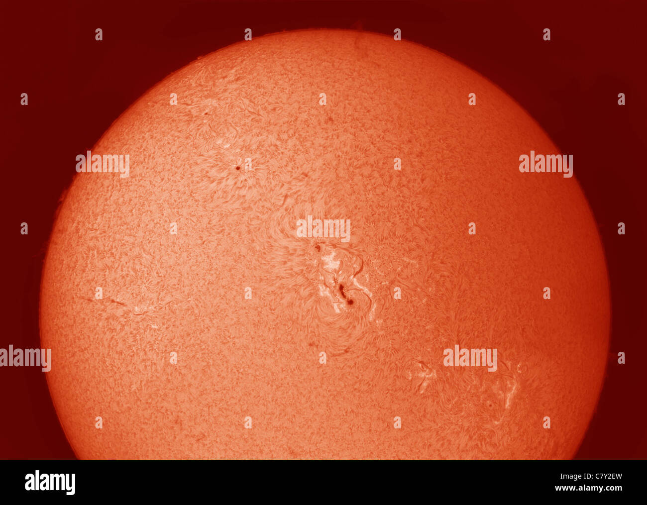 Surface of the sun photographed in Hydrogen alpha on 28.9.11 with sunspot 11302 prominent in the centre Stock Photo