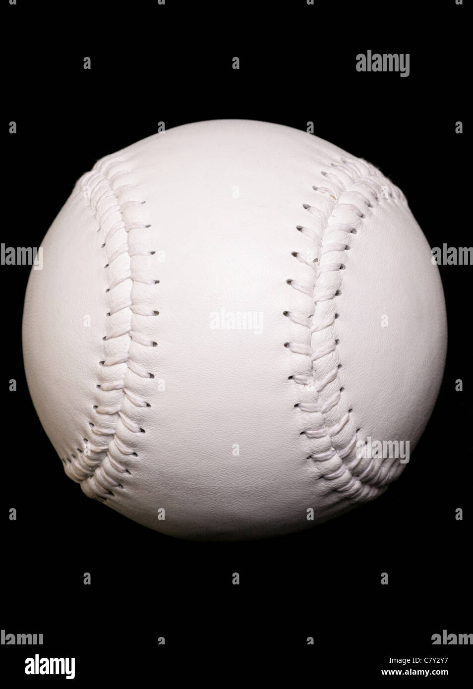 new white softball on black background Stock Photo Alamy