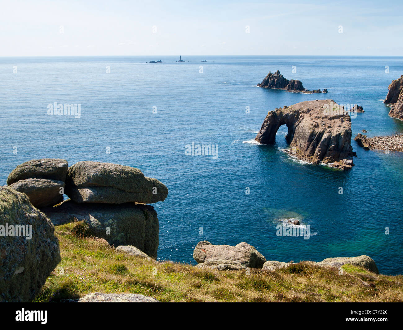 Rock formations off the coast at Lands End Cornwall England UK Stock Photo