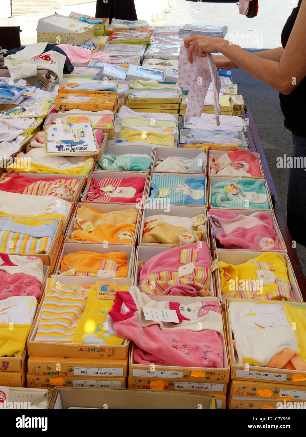 Market stall in Spain selling childrens clothes Stock Photo Alamy