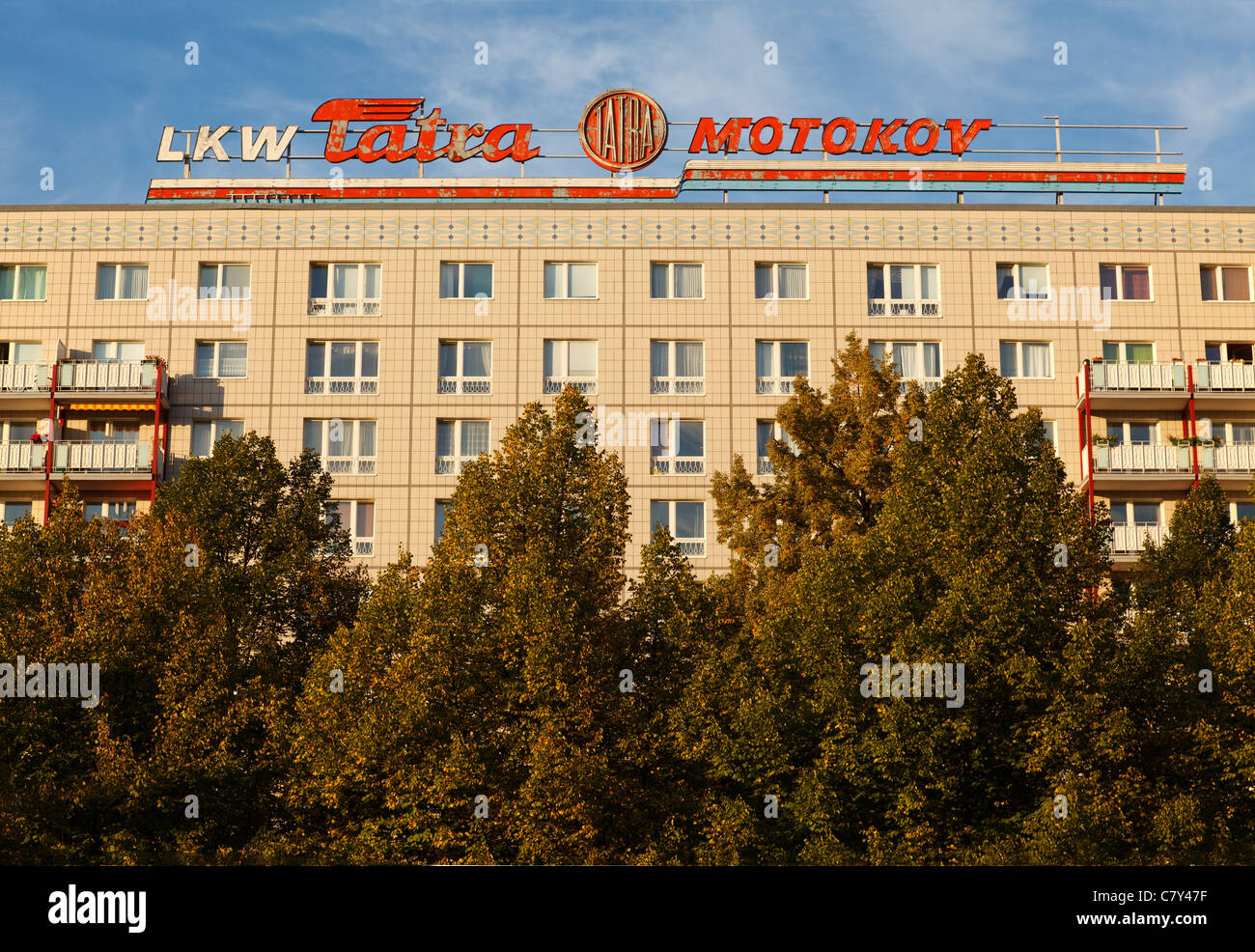 Plattenbau on Karl Marx Allee with LKW Tatra Motokov sign from DDR era, Berlin, Germany Stock Photo