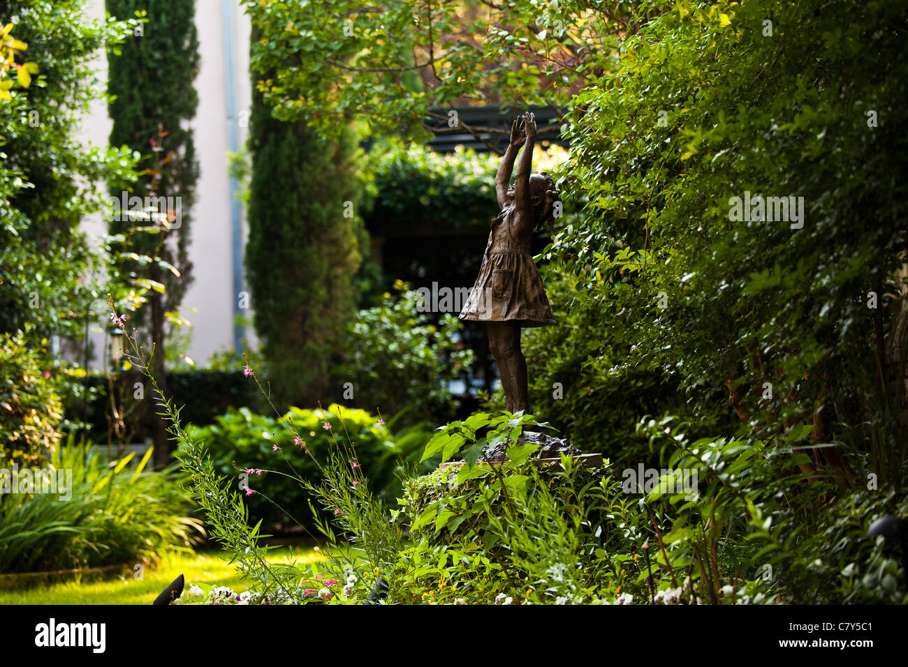 Statue in a private walled garden Charleston, SC Stock Photo Alamy
