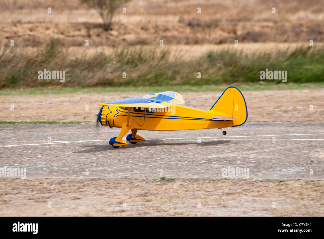 Radio control, yellow airplane in land Stock Photo