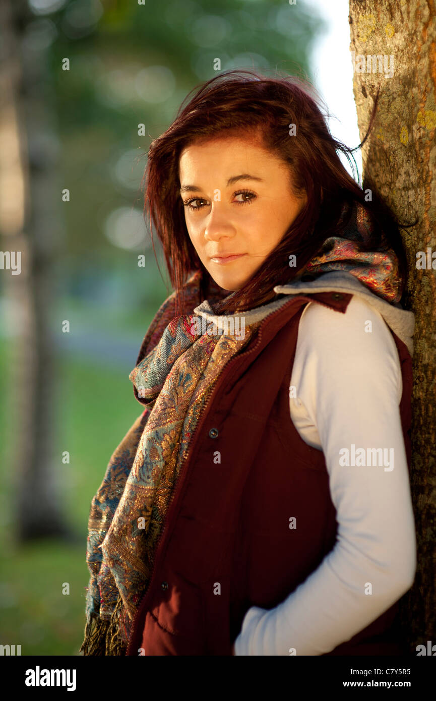 A 14 15 year old caucasian teenage girl , UK, outdoors, autumn, woodland Stock Photo