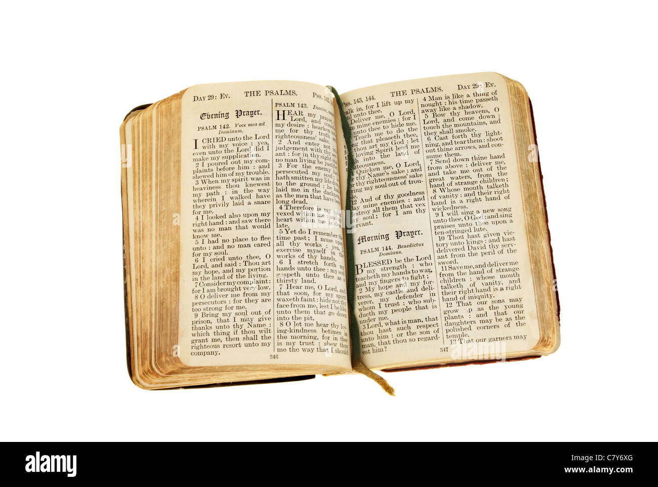 Antique Christian prayer book with pages open on an evening and morning prayer isolated against white Stock Photo
