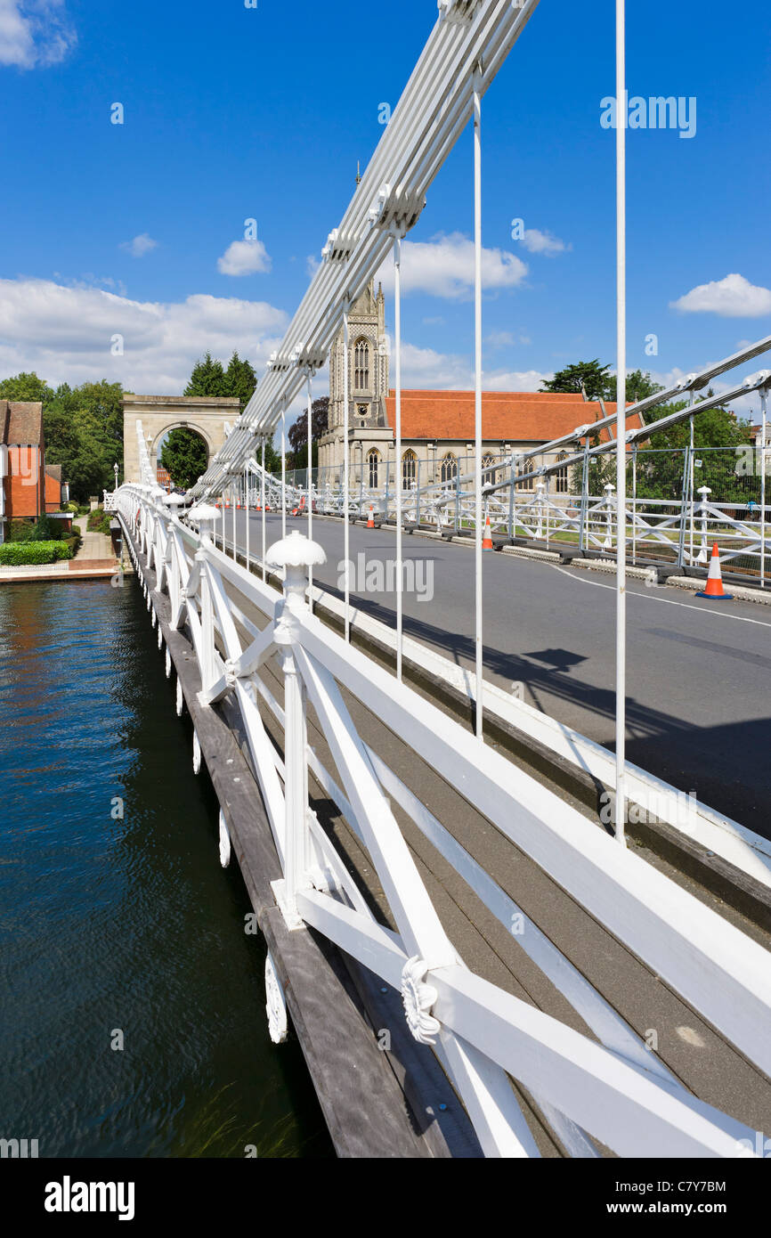 19th Century suspension bridge over the River Thames in Marlow with All Saints Church behind, Buckinghamshire, England, UK Stock Photo