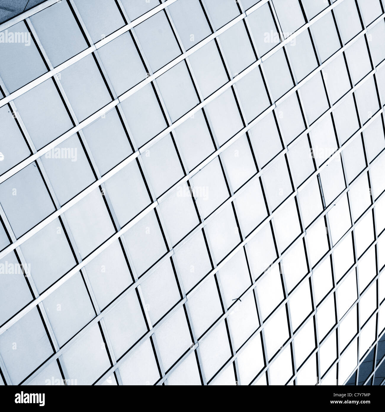 Windows of modern building toned in blue color Stock Photo - Alamy