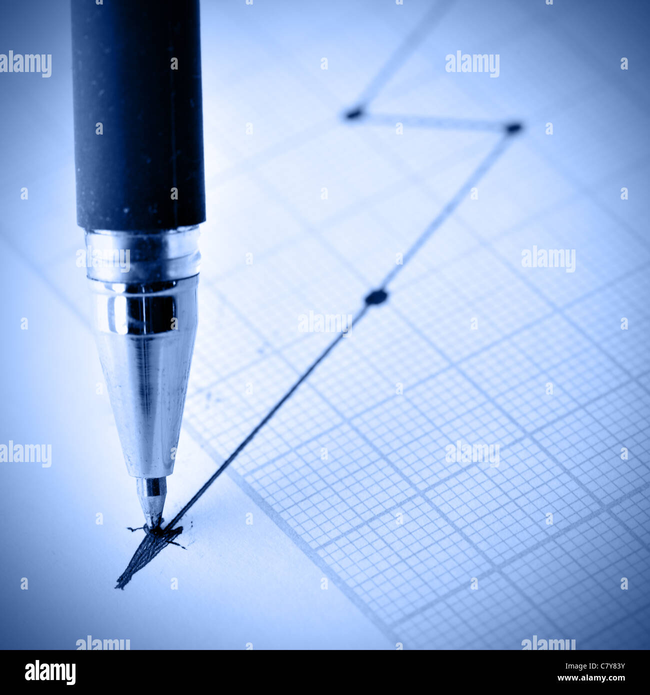 Pen drawing a crisis graph. Shallow DOF! Stock Photo