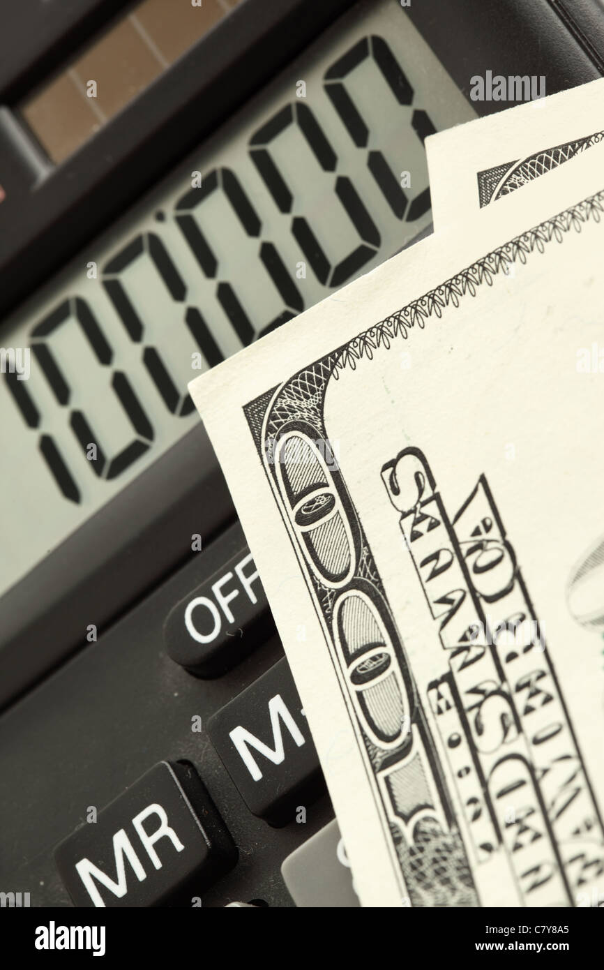 Dollar banknotes and calculator super close up Stock Photo
