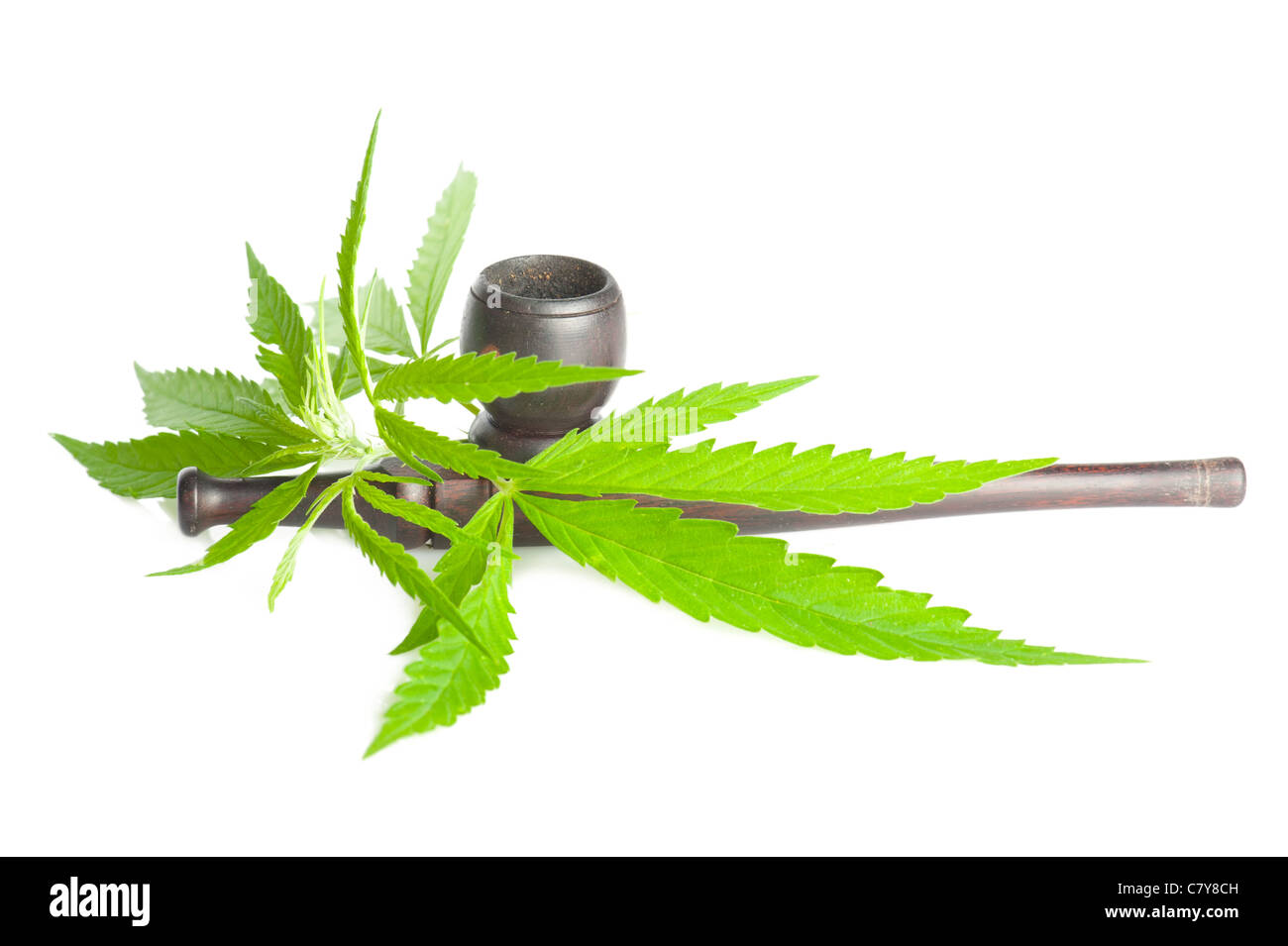 Cannabis. Marijuana leaf and smoking pipe isolated on white background Stock Photo
