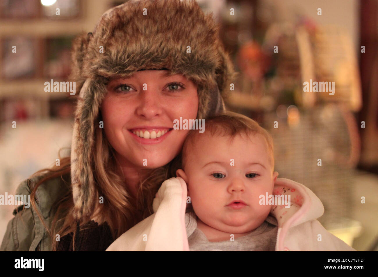 Attractive mother in Russian hat posing and holding baby Stock Photo