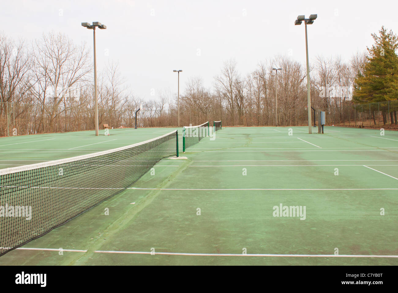 Series of side-by-side tennis courts in a rural resort setting Stock Photo