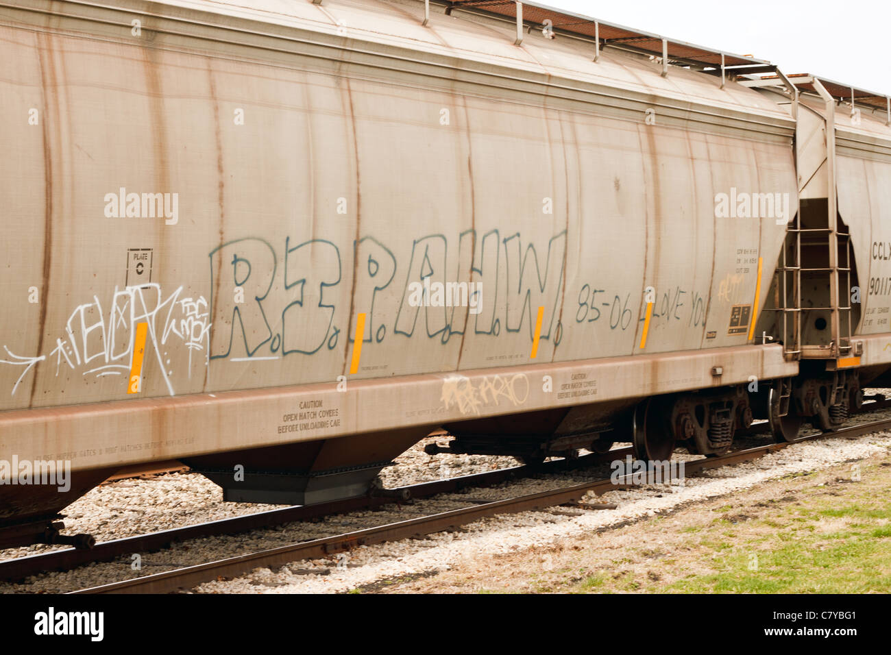 Uncolored graffiti on side of train cart Stock Photo