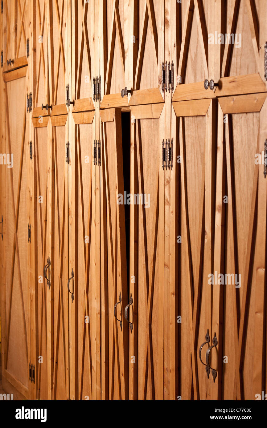 Warped cabinet door bending out from the rest Stock Photo