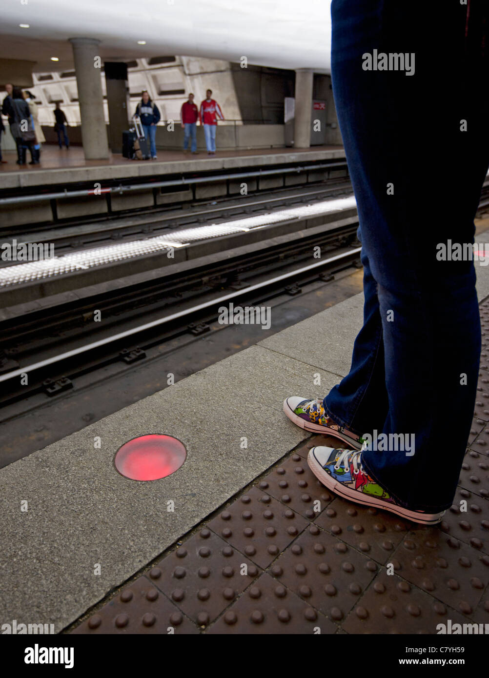 Washington DC Metro Rail Station with a view of a persons feet waiting for the subway train. Stock Photo