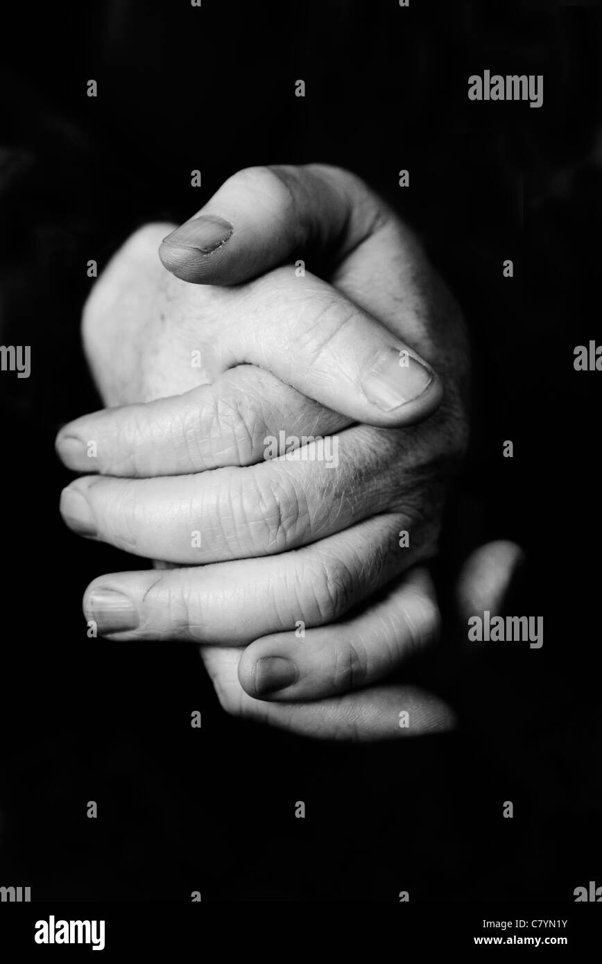 Clasped hands Stock Photo