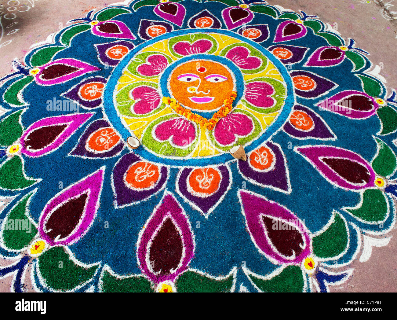 Rangoli design on an Indian street outside a hindu temple during ...