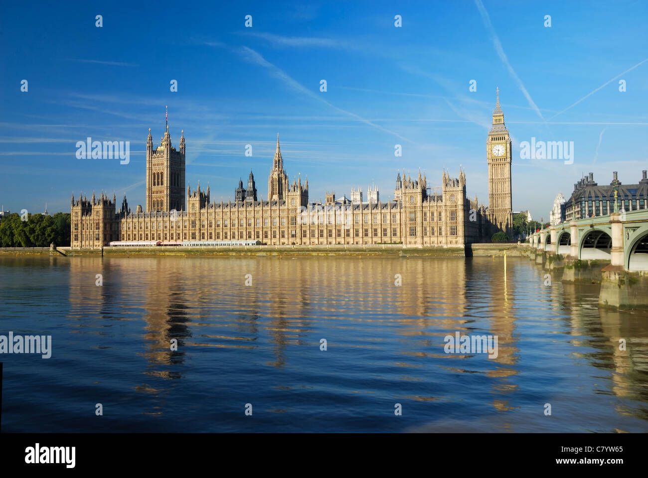 clear and bright sky, Palace of Westminster, housing the UK parliaments, sits beside the Thames