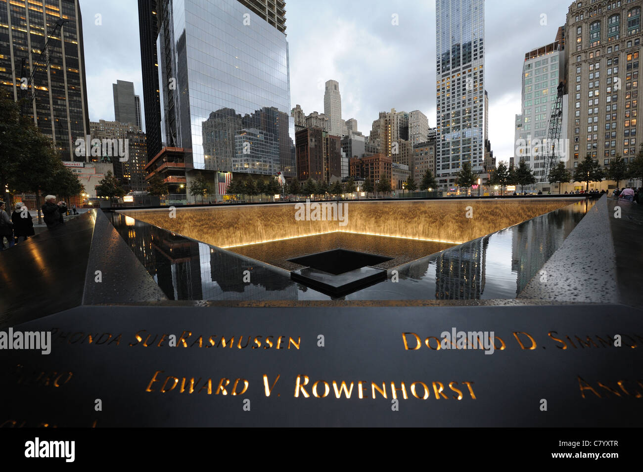 The National September 11 Memorial at the World Trade Center site in Manhattan has two pools with 30-foot-high waterfalls. Stock Photo