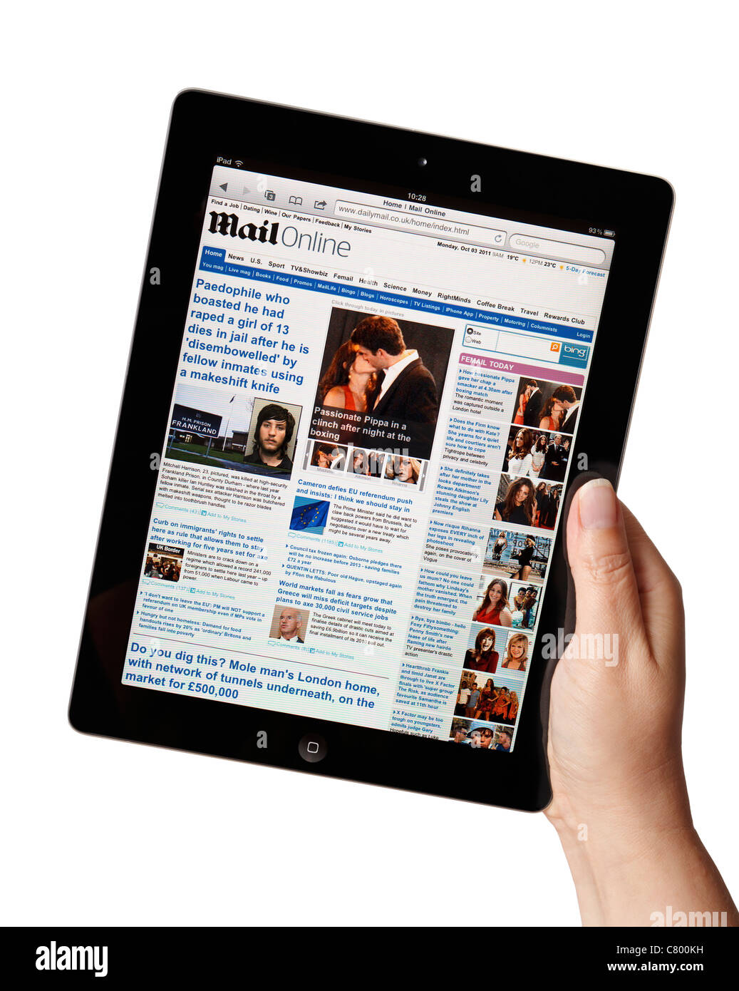 Hand holding iPad showing the Daily Mail newspaper online website Stock