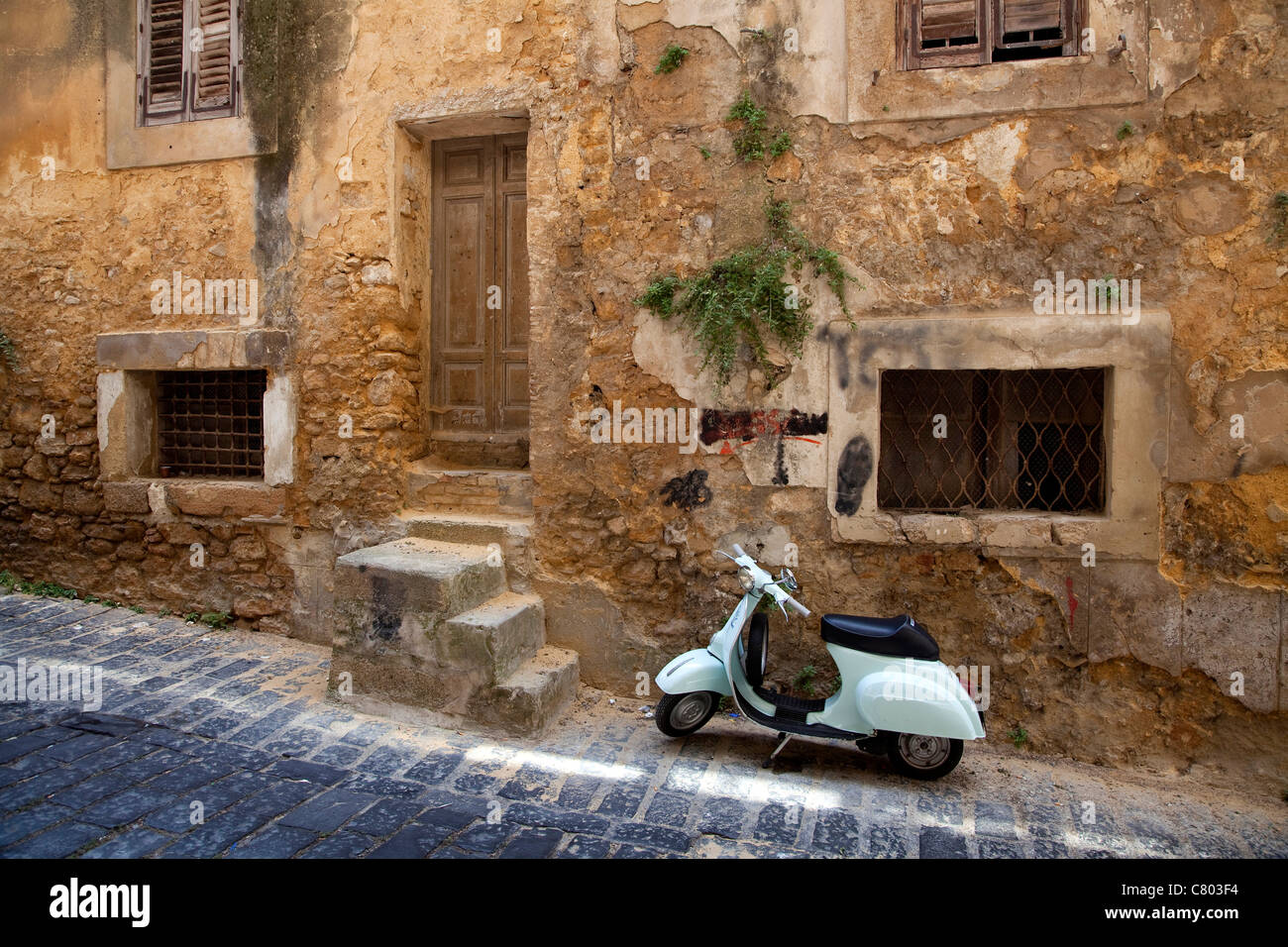 Vespa 50 scooter parked on the street in Caltagirone, Sicily, Sicilia, Italy Stock Photo