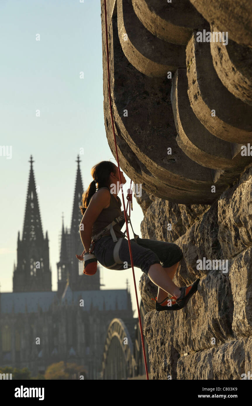 Climber at the Hohenzollernbrücke in Cologne Stock Photo