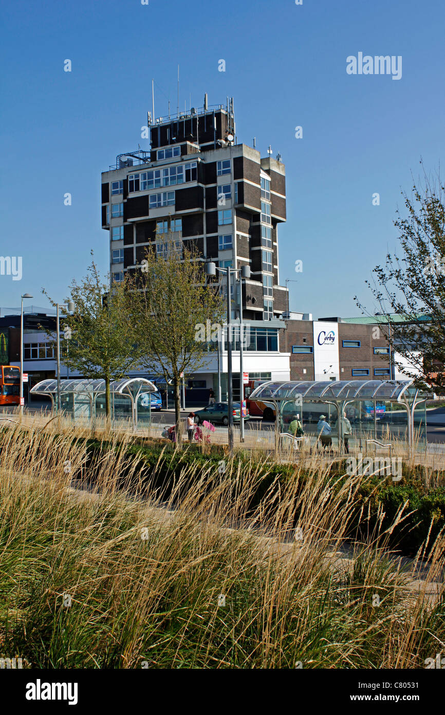 Ornamental grasses and trees decorate the streets and soften the outline of office blocks in the town centre of Corby Stock Photo