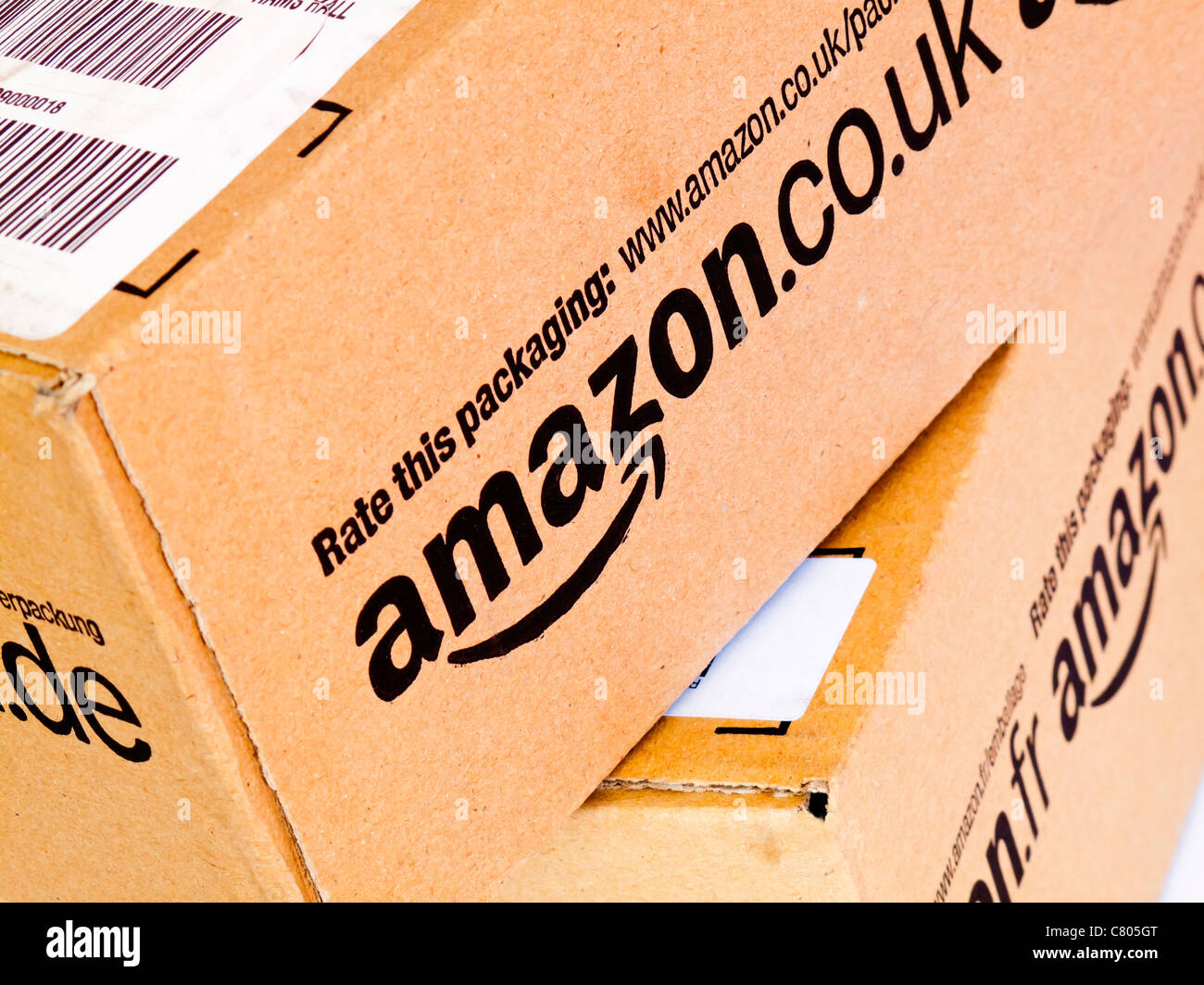 Cardboard boxes containing products sent from Amazon UK to a customer Stock Photo