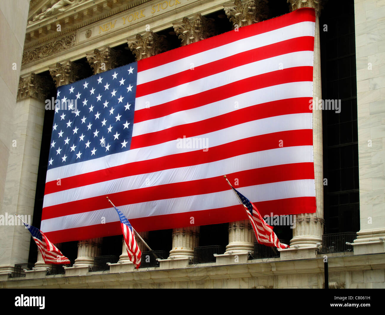 American flag hanging outside the Stock Exchange in New York Stock Photo