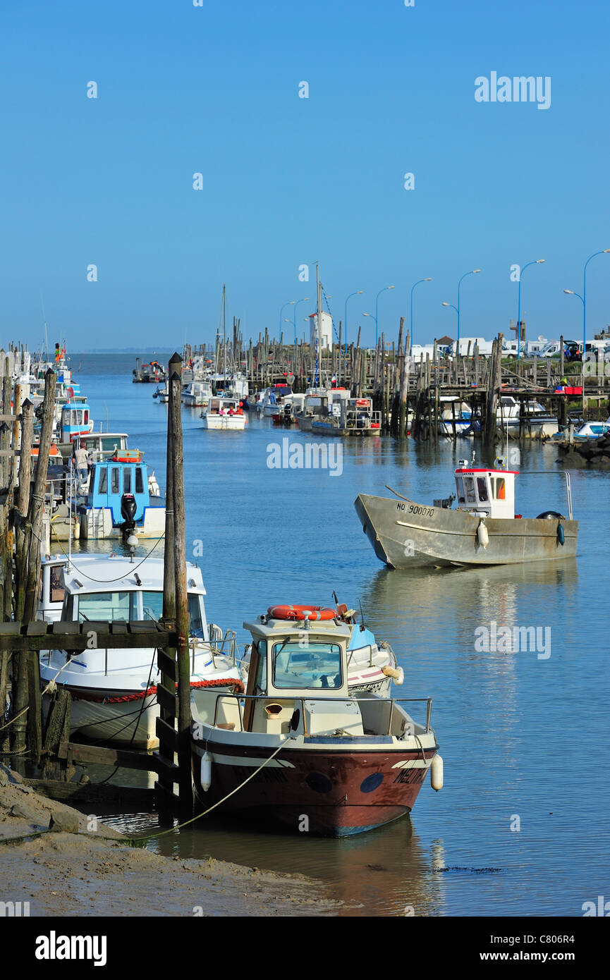 Fishing boats and oyster farming boats in the harbour Port du Bec near
