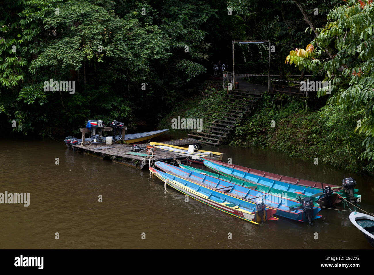 Canoes waiting to take tourists to the caves, Mulu National Park, Sarawak, Malaysian Borneo Stock Photo