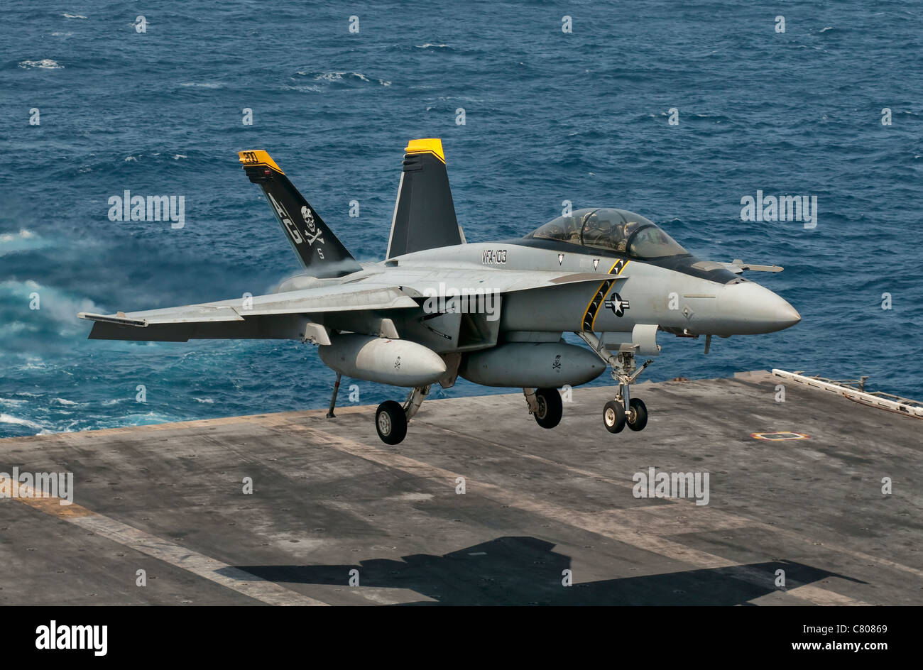 An F/A-18F Super Hornet prepares to land aboard USS Eisenhower. Stock Photo