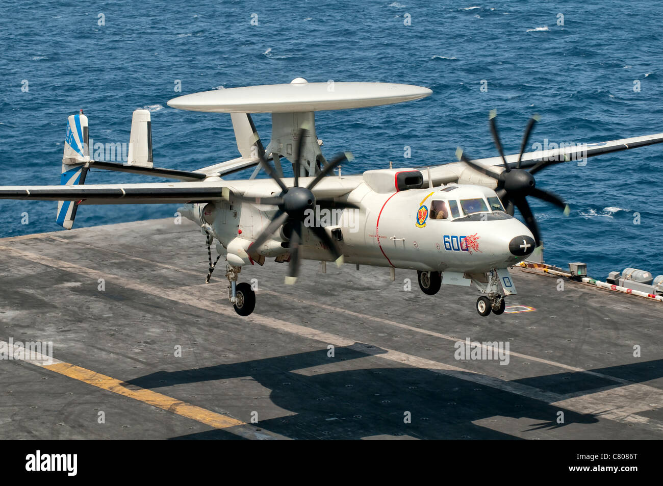 A US Navy E-2C Hawkeye prepares to land aboard USS Eisenhower. Stock Photo