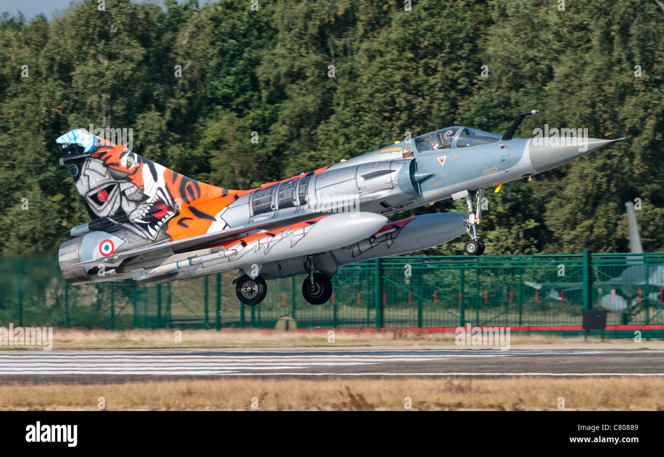 A French Air Force Mirage 2000 lands on the runway at Kleine Brogel Air Base, Belgium, during Tiger Meet 2009. Stock Photo