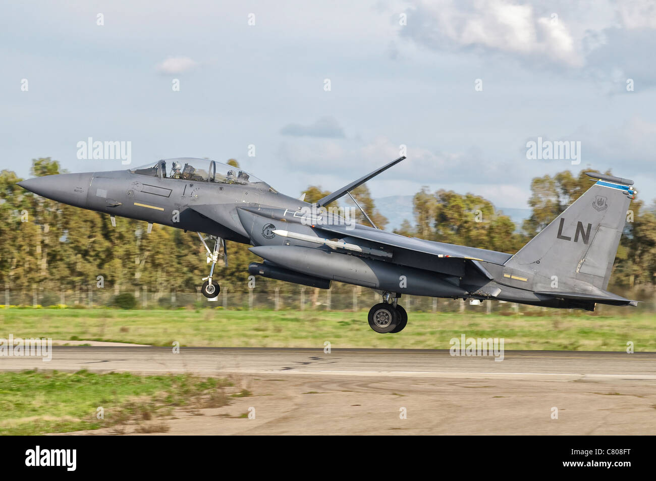 An F-15E Strike Eagle from RAF Lakenheath deploys from Decimomannu Air Base, Italy. Stock Photo