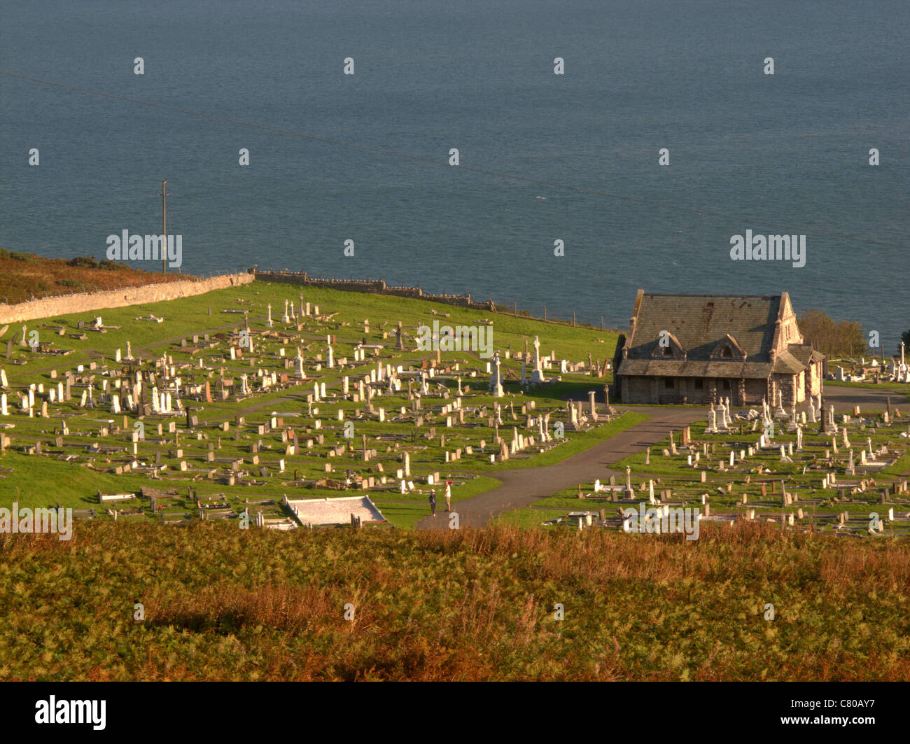 Great Orme, Saint Tudno with its churchyard and the adjacent town cemetery, Conway, Wales, September 2011 Stock Photo
