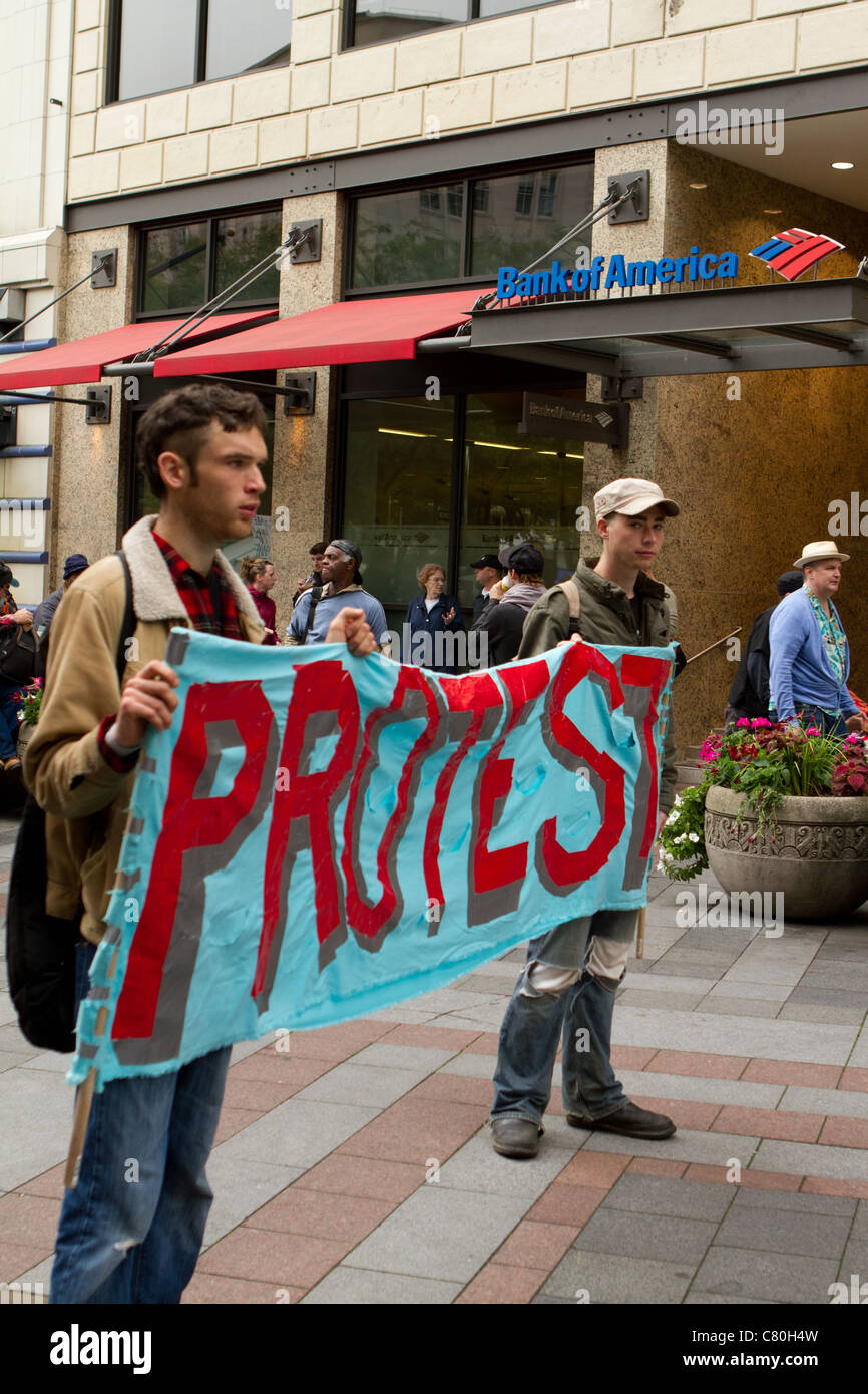 Protesters Hold A Sign In Front Of Bank Of America At The Occupy