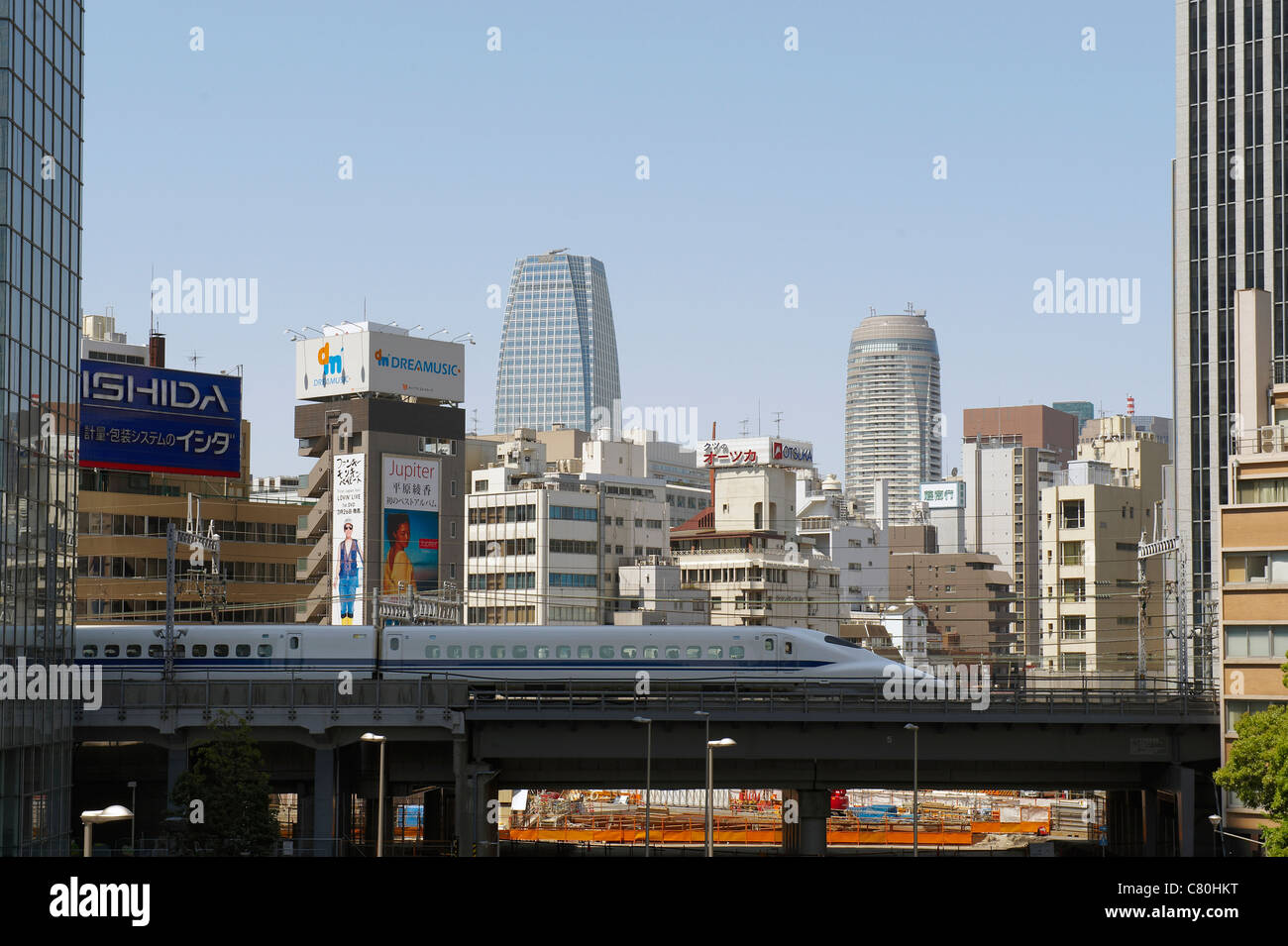 Japan, Honshu, Tokyo,Shinkansen Bullet Train and City Skyline Stock Photo