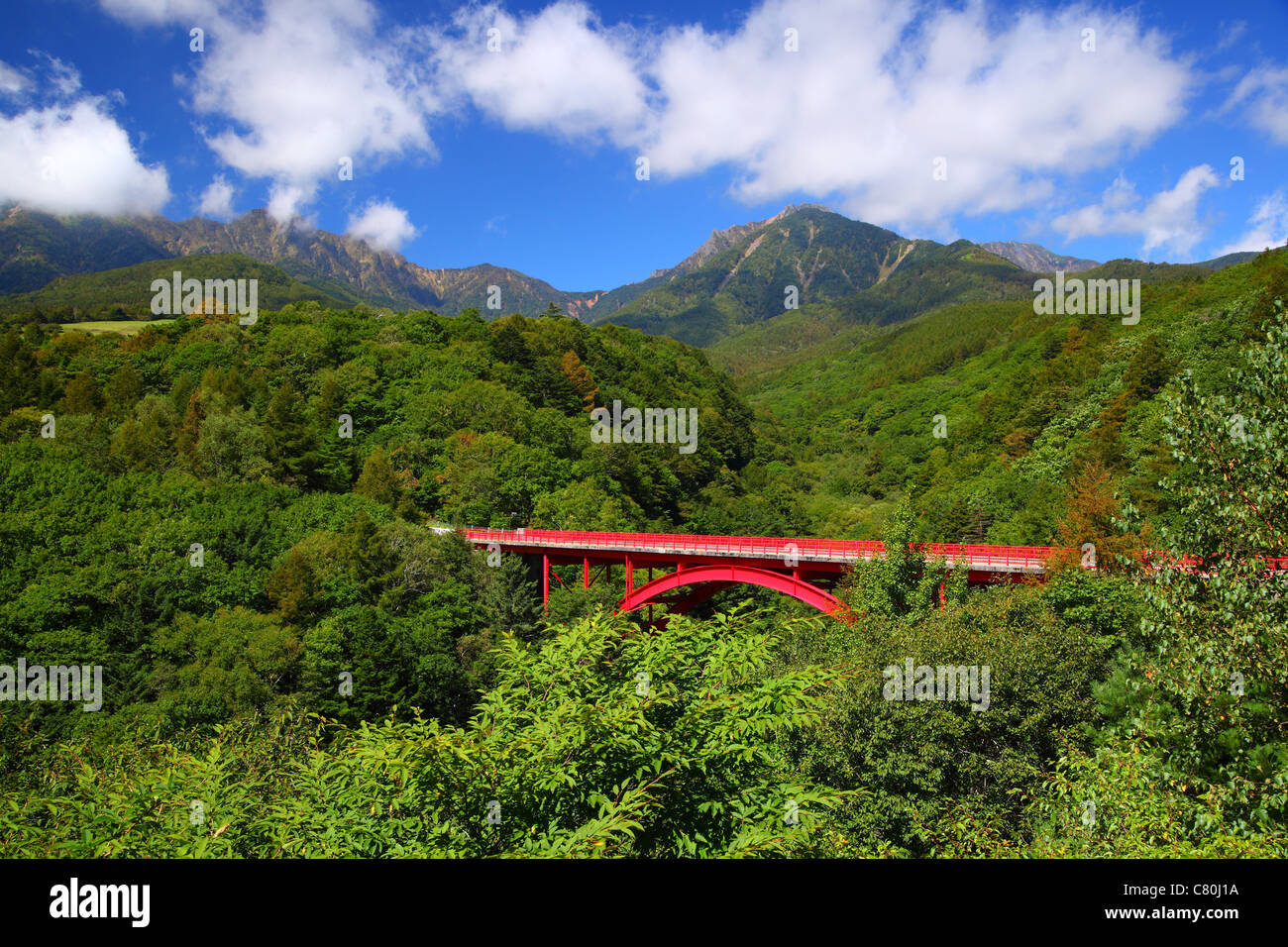 Red bridge with mountain Stock Photo Alamy