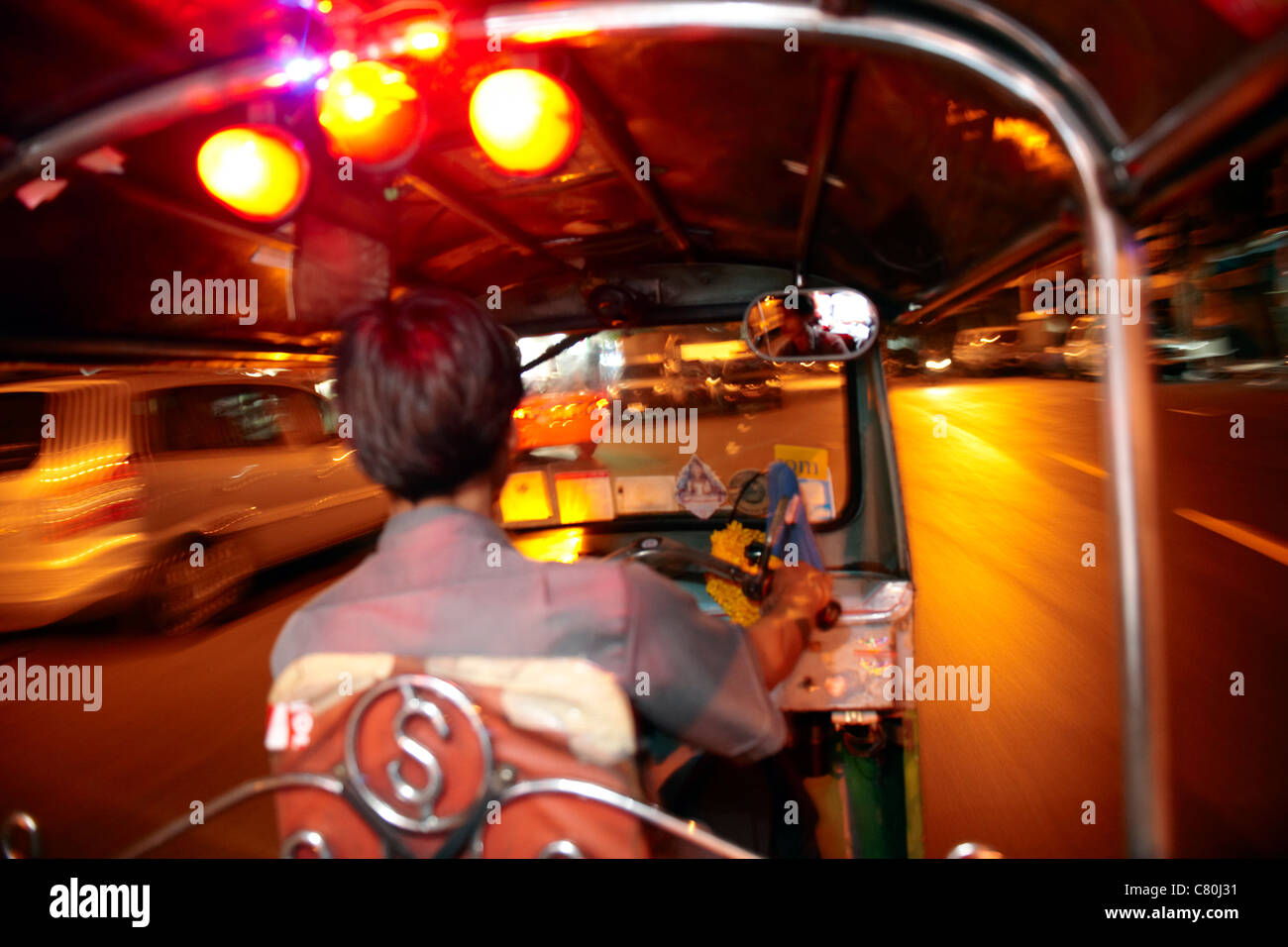 Thailand, Bangkok, Tuk Tuk Taxi Driver at night Stock Photo