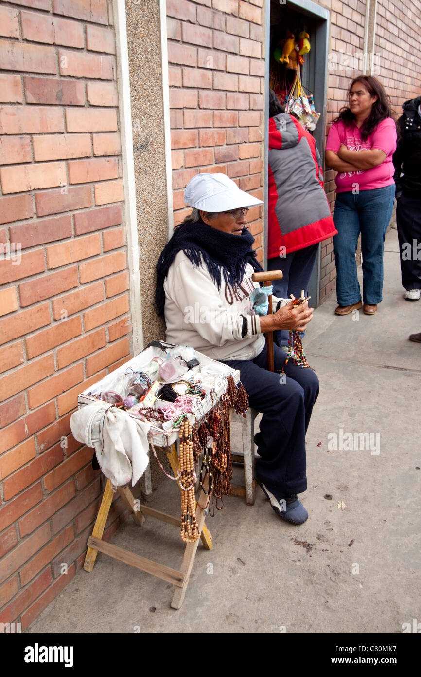peddler in the street showing her merchandise. Chiquinquirá, Boyacá, Colombia, Andes region, South Americaverti Stock Photo