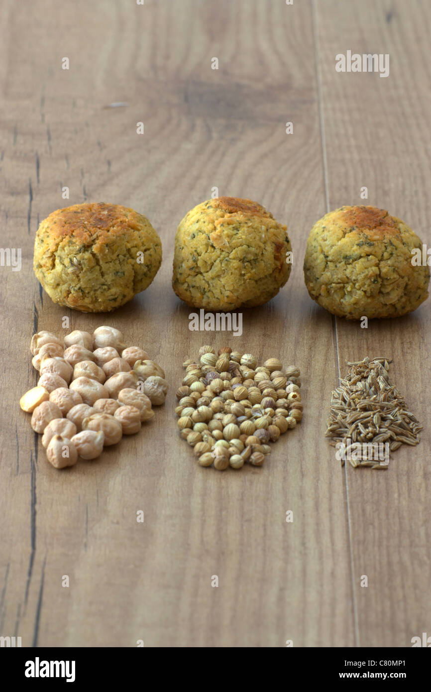 Selective focus image of dried chickpeas, coriander and cumin which are
