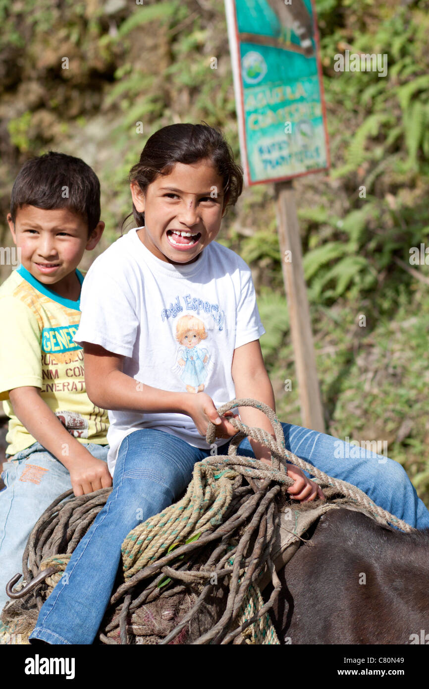 Children smiling riding an horse. Ibagué, Tolima, Colombia, South America Stock Photo
