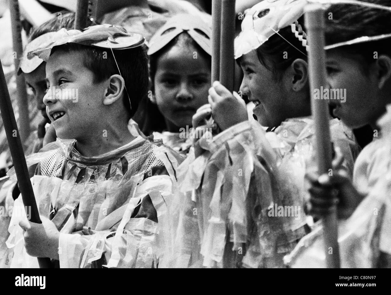 Masked children playing in the kindergarten. Moniquirá, Boyacá, Colombia, South America Stock Photo