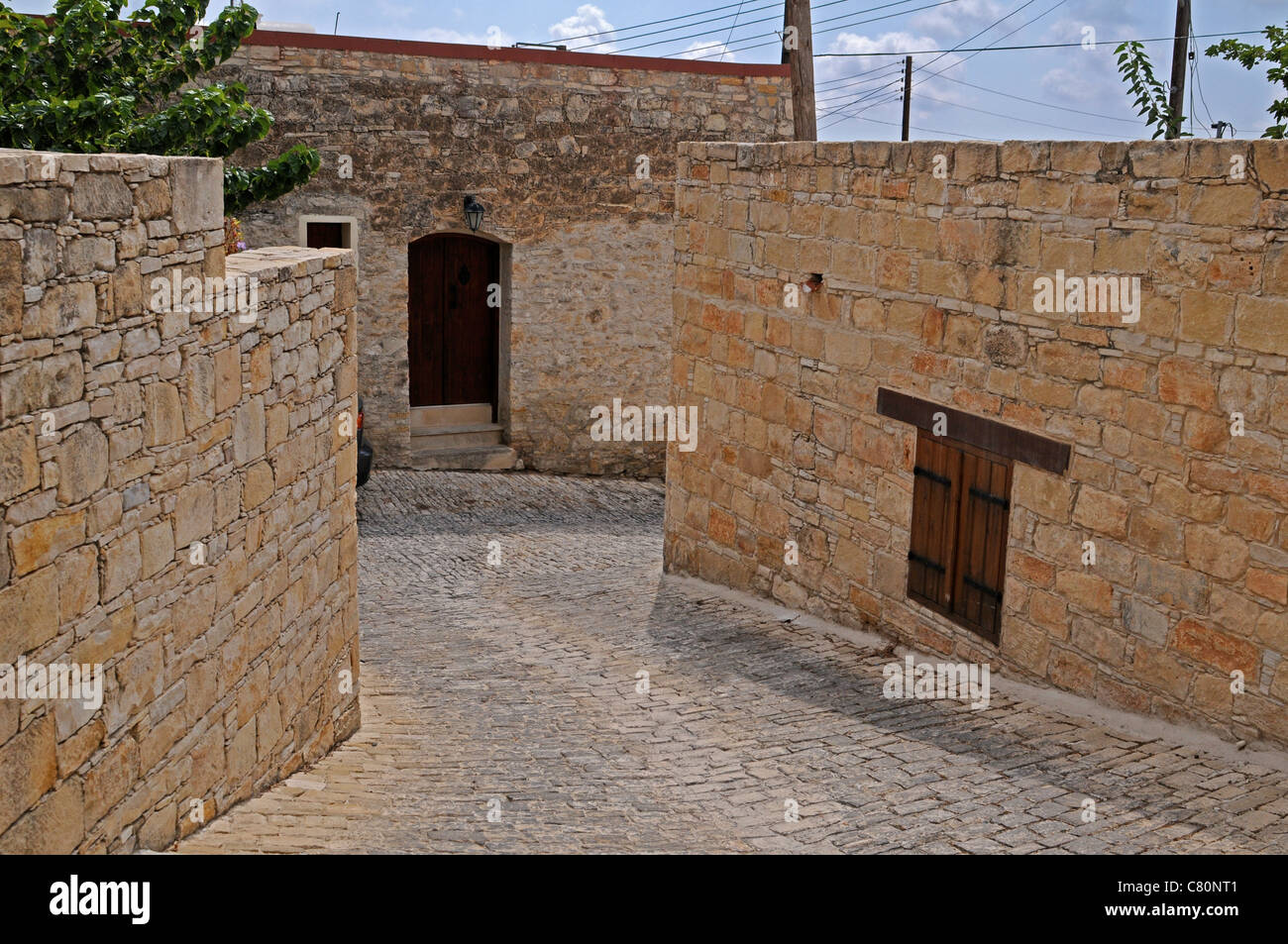 Stone buildings and cobbled street in Vasa a traditional small Cypriot village in the Troodos Mountains Stock Photo