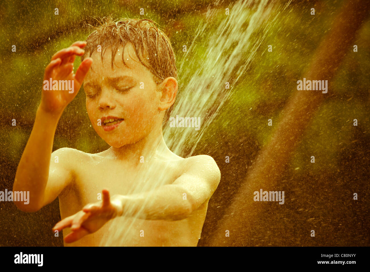 Vintage portrait of a young child playing with water Stock Photo