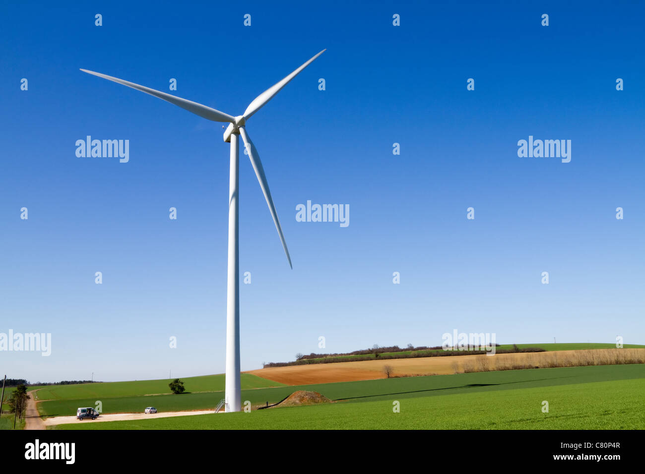 A wind turbine under clear blue sky Stock Photo - Alamy