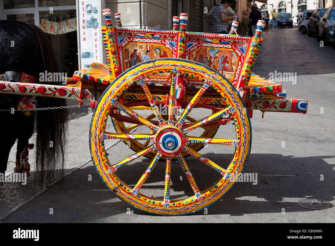 Colourful cart and cartwheel, Monreale, near Palermo, Sicily, Italy Stock Photo