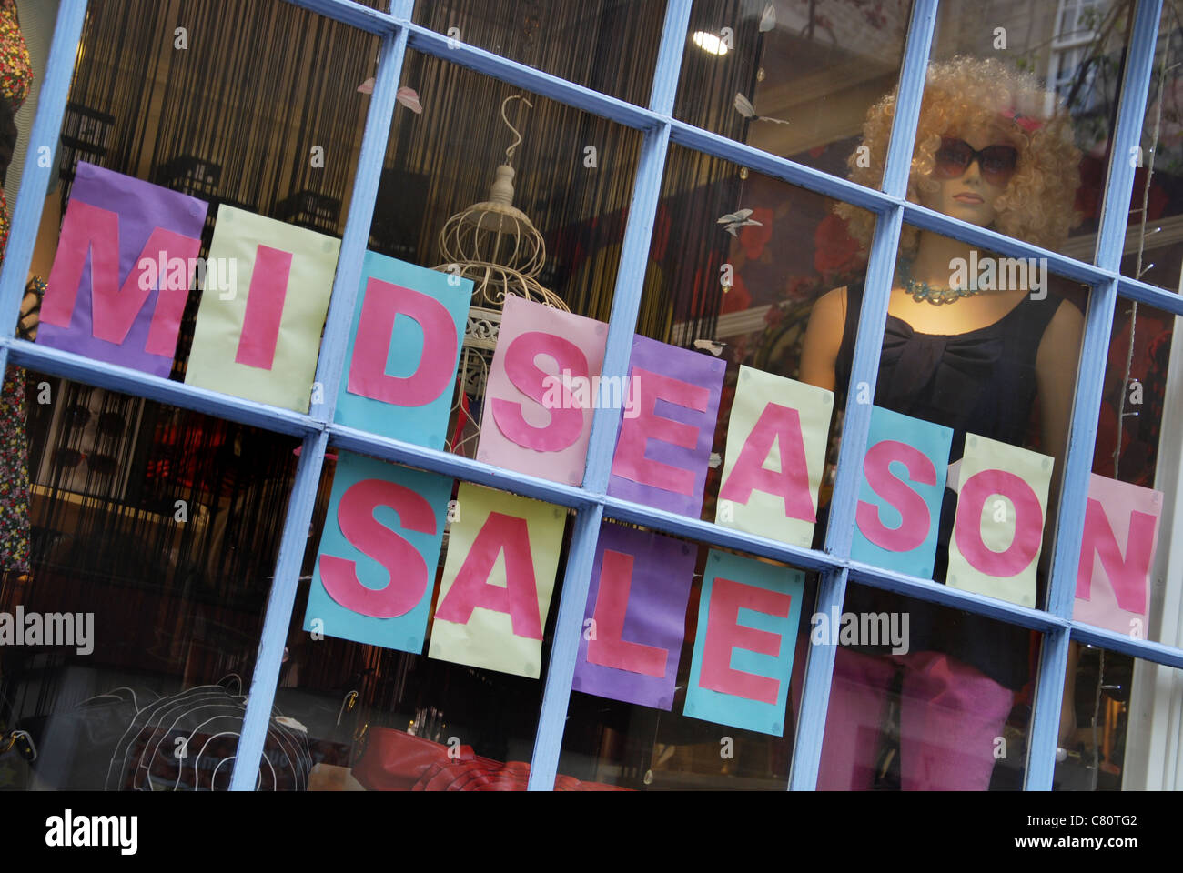 Premium Photo  Soldes french text means sale sign in clothing store on  rack display